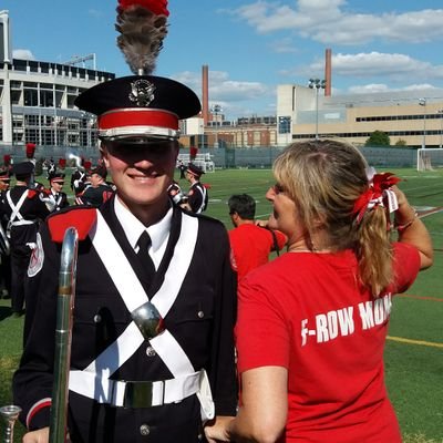 A profile photo that shows an Ohio State marching band drum major and a young woman
